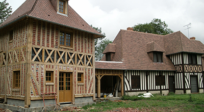 Extension par une tourelle et raccordement en terrasse